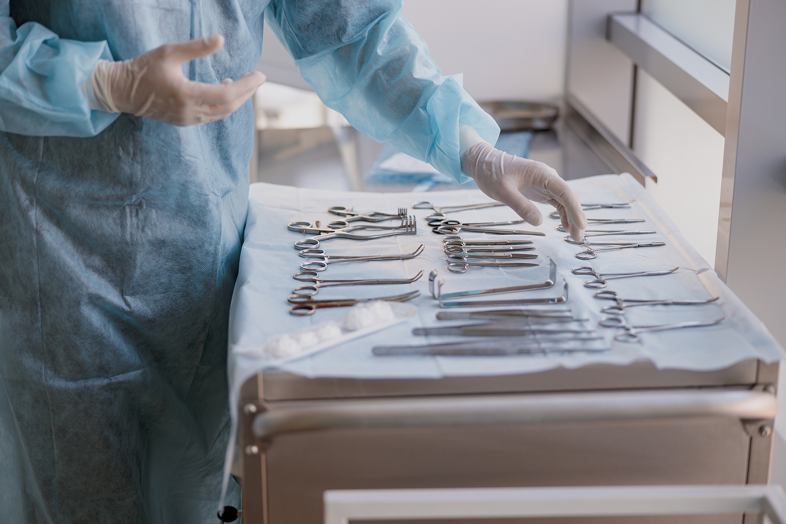 doctor handling surgical instruments